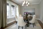 Dining-Rooms-Ivory-Tufted-Dining-Chairs-Round-Dining-Table-Rug-Art