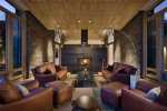 small-modern-living-room-rustic-house-with-chocolate-leather-sofa-chair-cushion-and-pouffe-plus-glass-table-indoor-fireplace-aluminum-floor-lamp-and-brick-wall