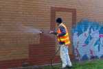 pressure-washing-the-brick-wall