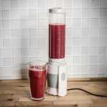 A juicer with a takeaway bottle